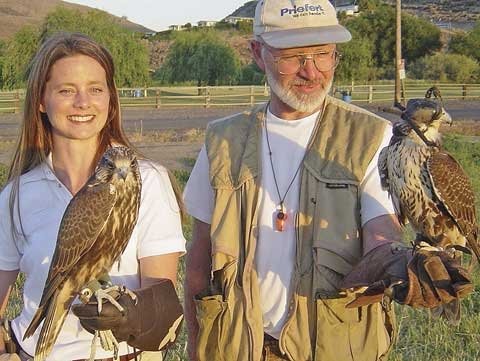 Marsha Flamm and Steve Siebert with two of their falcons. Photo by Mark Flamm