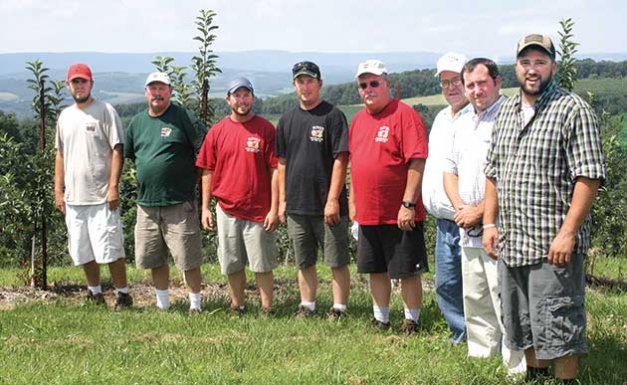 Men of the Boyer family pose atop Chestnut Ridge. From left, they are Ben, Bruce, Sam, Wesley, Matt, Dan, Seth, and Mark. by Richard Lehnert