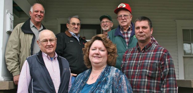 Growers Credit Corporation board members and staff leave their last board meeting. Pictured are (from left) Bob Petersen of Manson, Gary Roberts of Oroville, former manager Steve Joy, office manager Nancy Baker, Roger Hodgson of Omak, Gene  Handley of East Wenatchee, and  Floyd Stutzman of Wenatchee.