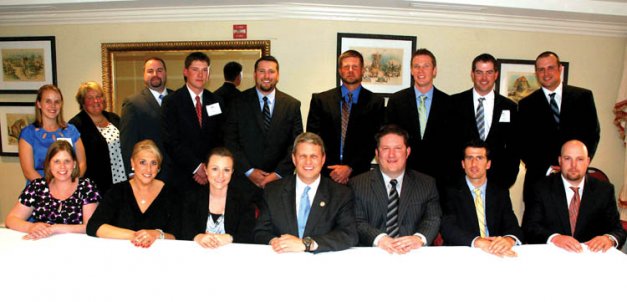 The Young Apple Leaders of 2012 are, back row left to right, Sarah Dressell, Sara Shanteau, Casey Collins, Adam Peters, Mark Boyer, Dave Gargasz, Jeff Armock, Mark Stennes, and Andy Ferguson; front row, Holly Rogers-Rios, Stephanie Shoemaker, Valerie Ramsburg, Congressman Bill Huizenga, Daniel Rock, Chris Willett, and Justin Finkler.