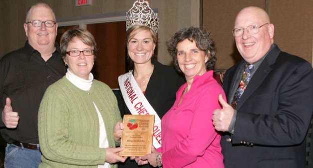 Jim and Rose King, at left, and John and Betsy King, right, pose with their award and the National Cherry Queen Maria LaCross, who hails from a tart cherry farm close to King Orchards.