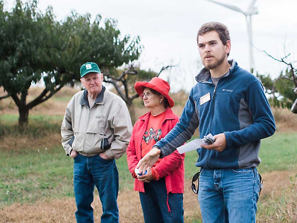 Michigan State University Extension tree fruit educator David Jones, right, leads a grower class in 2017. After fire blight became an issue in many Michigan apple orchards in 2018, Jones and a statewide team began searching for the cause of the outbreak. Jones focused on West Central Michigan and whether streptomycin resistance may have played a role. (Courtesy David Jones/MSU Extension)