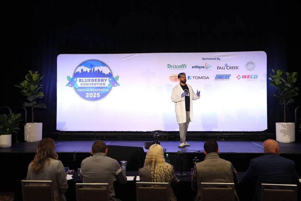 Dylan Paul of Pluff pitches his company’s blueberry-based protein dessert to a panel of judges in a “Shark Tank-style” competition at the Blueberry Convention on Oct. 9, 2025, in Seattle, Washington. (Ross Courtney/Good Fruit Grower)