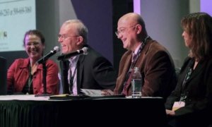 Kate Evans, Tom Auvil, Stefano Musacchi and Ines Hanrahan share a laugh during the question, answer portion of the Cosmic Crisp horticultural panel on December 5, 2016. (TJ Mullinax/Good Fruit Grower)