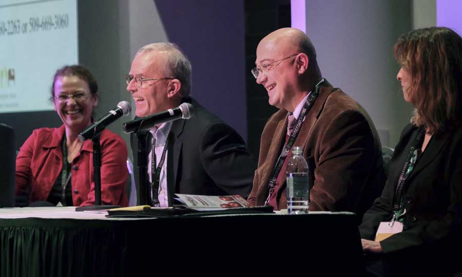 Kate Evans, Tom Auvil, Stefano Musacchi and Ines Hanrahan share a laugh during the question, answer portion of the Cosmic Crisp horticultural panel on December 5, 2016. <b>(TJ Mullinax/Good Fruit Grower)</b>