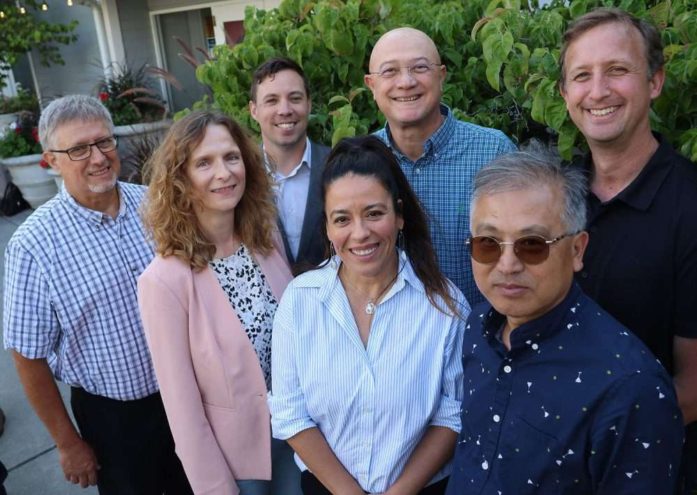 Sam Godwin and Ines Hanrahan pose with the five endowed chairs currently supported by the $32 million tree fruit endowment.