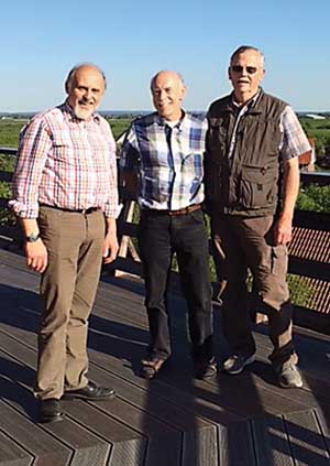 David Granatstein (center) and Harold Ostenson (right) visit with Peter Rolker of Rolker Fruit, an organic fruit producer in the Altes Land area of Germany.