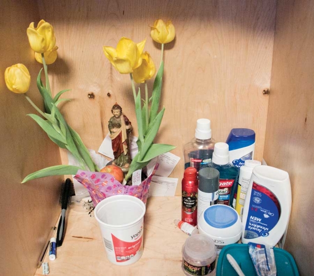 A shrine to St. Jude shares shelf space with mouthwash and shampoo in the room of Jose Herrera and Roberto Gonzalez on Monday, March 28, 2016, at the Brender Creek seasonal farm worker housing facility in Cashmere, Washington. Whether growers hire domestic migrants or H-2A foreign guest workers, temporary housing needs are becoming more pronounced and more tightly regulated. <b>(Ross Courtney/Good Fruit Grower)</b>