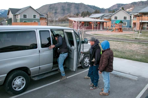 H-2A guest worker tenants of the Brender Creek seasonal farm worker housing facility in Cashmere, Washington, board a van early Tuesday morning, March 29, 2016, headed toward a day of pruning pears near Wenatchee. Whether growers hire domestic migrants or H-2A foreign guest workers, temporary housing needs are becoming more pronounced and more tightly regulated. (Ross Courtney/Good Fruit Grower)