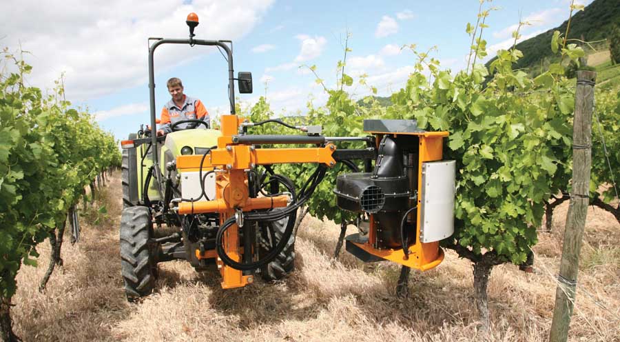 A new grape leaf puller for vineyards uses pressure sensors to follow the contours of canopies during leaf removal. <b>(Courtesy Vine Tech Equipment)</b>