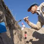 Sebastian Traviesa searches for soil texture layers during a viticulture field day