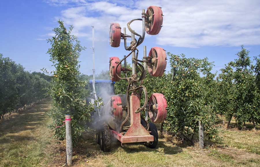 Cornell researchers show how attaching a series of ultrasound sensors to a sprayer provides information about gaps in the tree canopy and, by controlling the fan, reduces air speed. <b>(Shannon Dininny/Good Fruit Grower)</b>