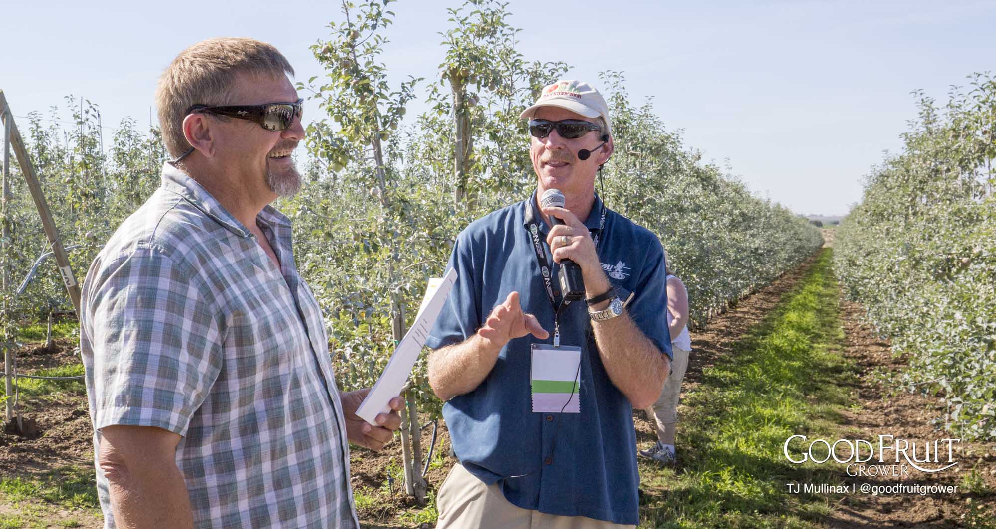 Jamie Jamison (left) - We are putting Surround on our south facing apples to help manage fruit temperatures. <b> (TJ Mullinax/Good Fruit Grower)</b>