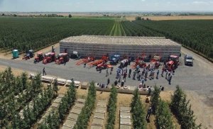 Harvesting, pruning, trimming and bin removal machines like these displayed during an IFTA tour last summer in Washington can help growers reduce labor, improve orchard production and decrease costs. (TJ Mullinax/Good Fruit Grower)