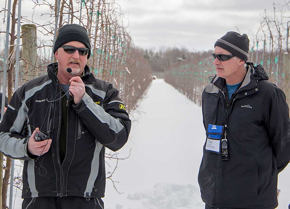 Brothers and partners, Todd Furber, left, and Ted Furber, explain some of their plant growth regulator and hail net trials at Cherry Lawn Fruit Farms in Sodus, New York. (Ross Courtney/Good Fruit Grower)
