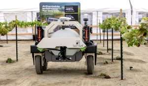 An autonomous platform from Bonsai Robotics, which acquired farm-ng in 2025, mounted with a WEED-IT smart sprayer for a demonstration in February during the World Ag Expo in Tulare, California. (Kate Prengaman/Good Fruit Grower)