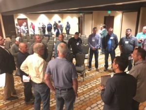 Northwest cherry growers huddle by district to discuss their projected crop estimate Wednesday, May 17, 2017, at the annual 5-state cherry meeting in Richland, Washington. They are calling for a 22.7 million box crop.<b>(Ross Courtney/Good Fruit Grower)</b>