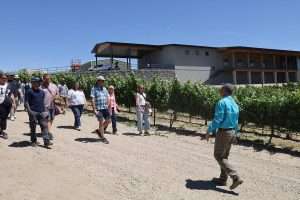 Jay Hawkins leads a tour group from the American Society for Enology and Viticulture through his Sunnyslope, Idaho, vineyard