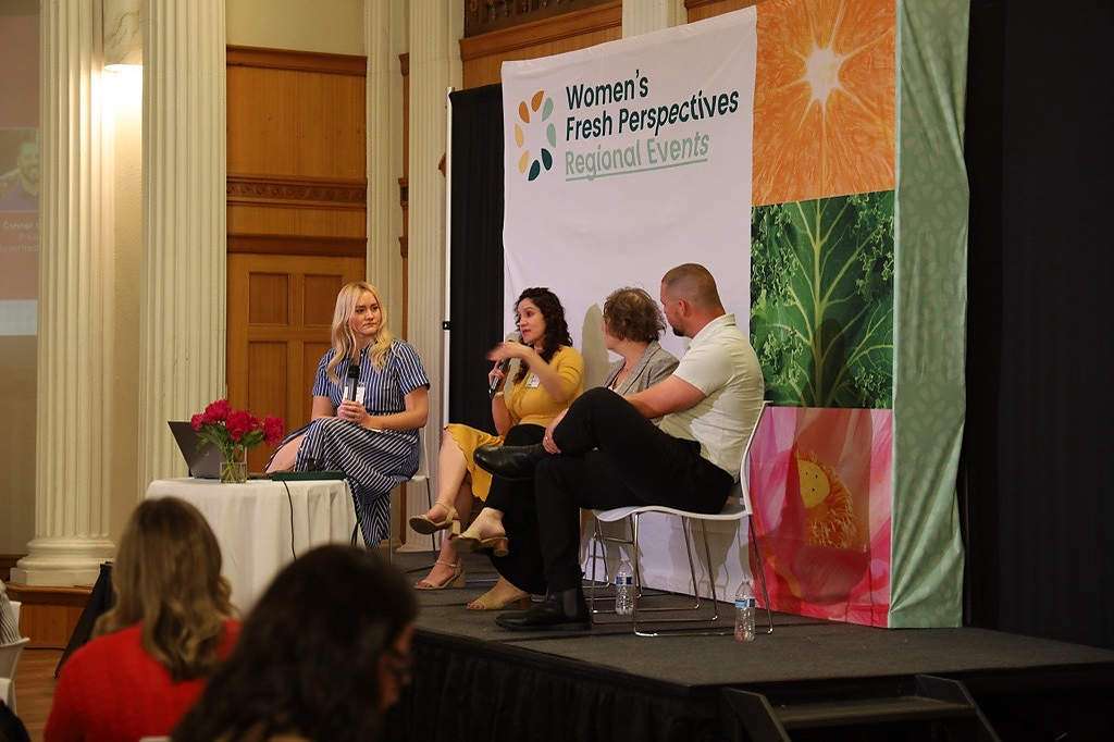 Seated second from left, Jacqui Gordon Nuñez, vice president of the Washington State Tree Fruit Association, described the difference between leadership and management. “You lead people, you manage things,” she said, the latter being things like schedules and project responsibilities. That’s why good leadership requires an understanding of the emotions underlying people’s behavior, she said. (Kate Prengaman/Good Fruit Grower)