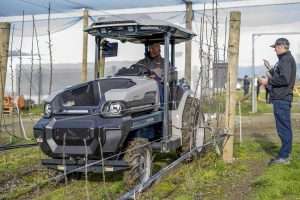 Forest Lodge Orchard imported a Monarch electric tractor from California in 2023 and had a New Zealand company build a custom electrostatic sprayer to run off the tractor’s battery. Importing emerging technology poses a risk, owner Mike Casey acknowledged, including from Monarch, which went out of business earlier this year. Overall, though, he has found strong return on investment from going electric. (Courtesy Forest Lodge Orchards)