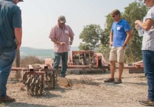 Grower Rick Orozco describes the benefits of regular cultivation with a wonder weeder to attendees on a WSU NextGen Grower field day on transitioning to organic production at his HiPoint Orchards near Pasco, Washington on August 3, 2017. (Kate Prengaman/Good Fruit Grower)