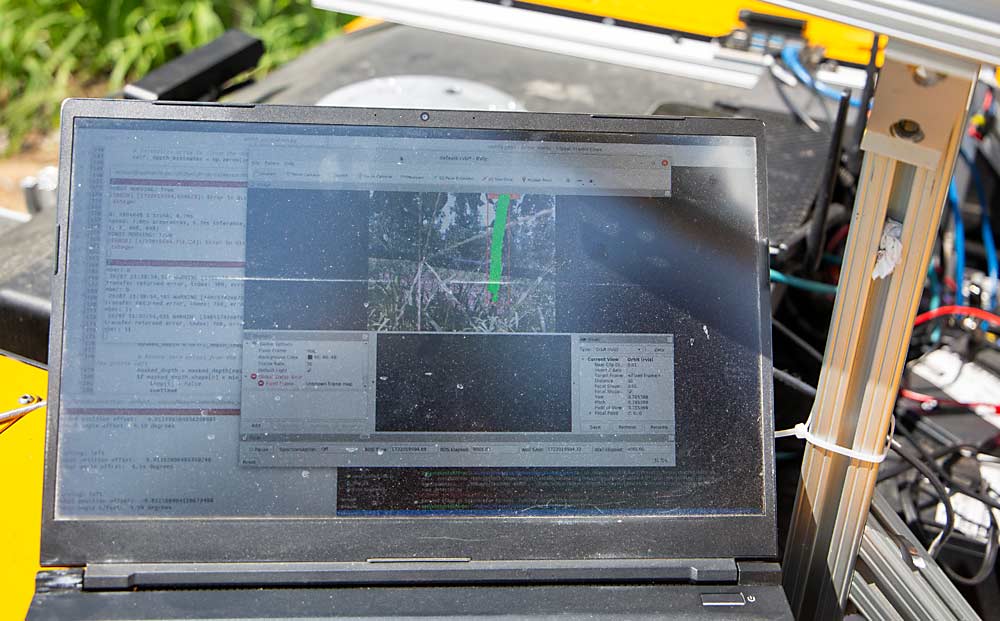 The robot’s computer vision recognizes individual trunks, allowing for tree-specific fertilizer application, as demonstrated at the Smart Orchard Field Day in July this year in Mattawa, Washington. (Ross Courtney/Good Fruit Grower)