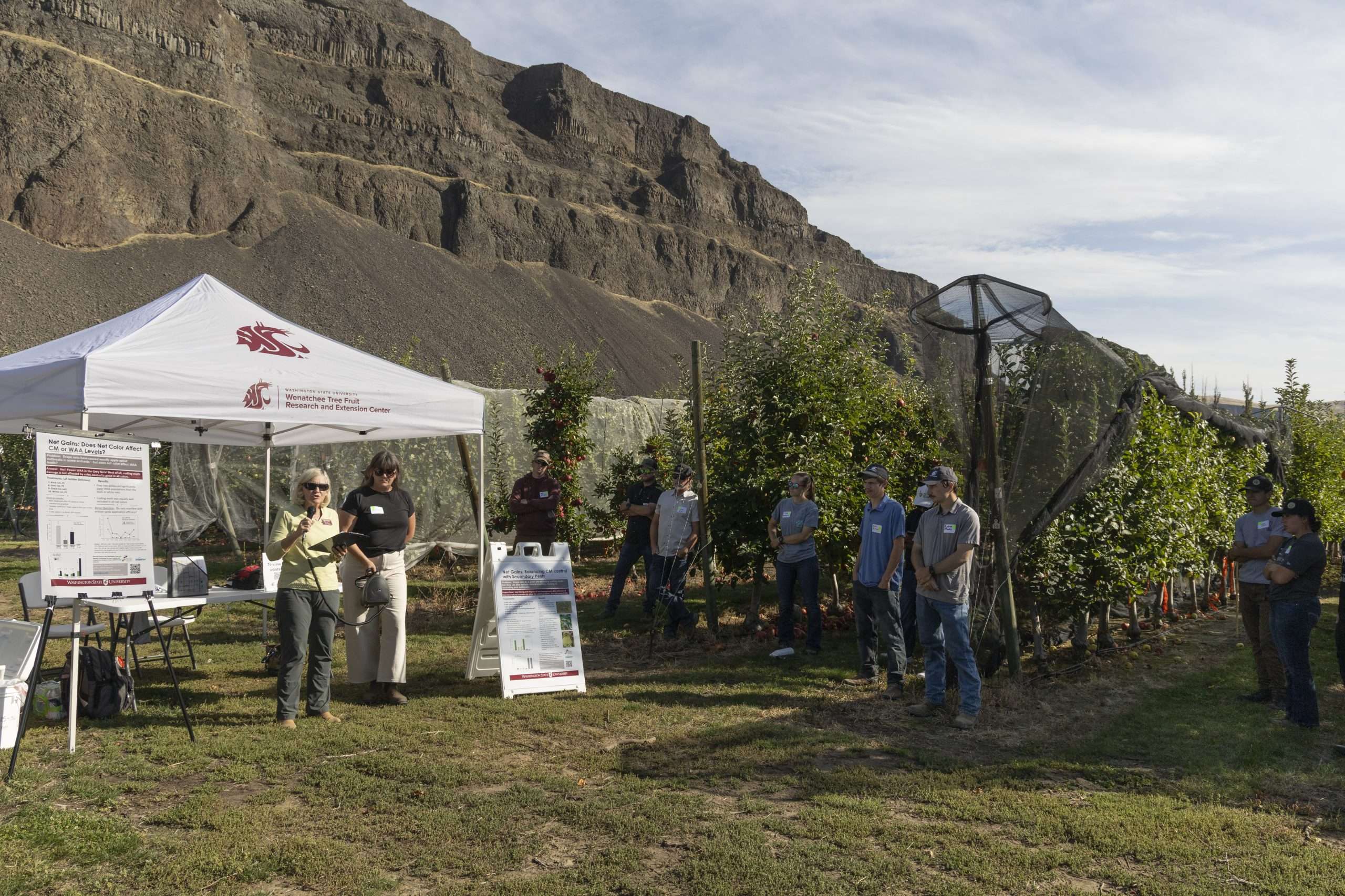 WSU entomologist Besty Beers, left, talks to attendees at the Sunrise Field Day on Sept. 23