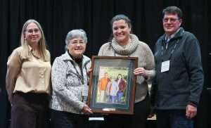 From left, Good Fruit Grower managing editor Shannon Dininny and the DeMarree family, Alison, Kristen and Tom, the 2025 Good Fruit Growers of the Year. (TJ Mullinax/Good Fruit Grower)