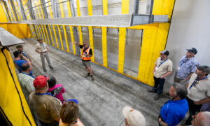 Marius Voigt, operations manager for Fruit2U Packers, gives the International Fruit Tree Association a tour of the forced air “tunnels” that are used to quickly cool pallets of packed stone fruit, table grapes and citrus, depending on the season, at the facility in Wellington, South Africa. (TJ Mullinax/Good Fruit Grower)