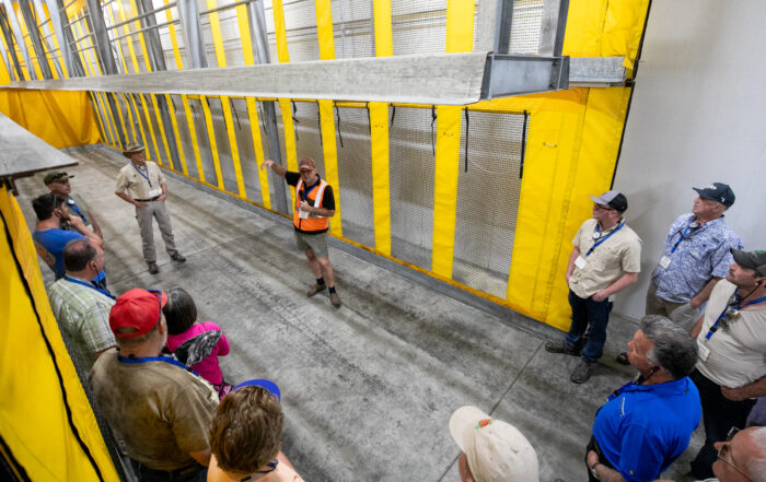 Marius Voigt, operations manager for Fruit2U Packers, gives the International Fruit Tree Association a tour of the forced air “tunnels” that are used to quickly cool pallets of packed stone fruit, table grapes and citrus, depending on the season, at the facility in Wellington, South Africa. (TJ Mullinax/Good Fruit Grower)