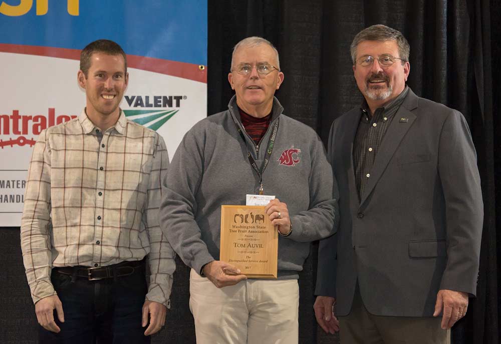 Tom Auvil is honored with the Washington Tree Fruit Distinguished Service award during the Washington State Tree Fruit Association 113th Annual Meeting on December 5, 2017. <b>(TJ Mullinax/Good Fruit Grower)</b>