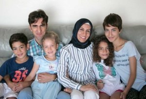 Visiting Turkish fruit breeder Gökhan Öztürk poses with his family at their temporary home in Wenatchee, Washington, near the Washington State University Tree Fruit Research and Extension Center, where he is studying breeding management techniques. His wife, Pinar, is also a fruit researcher in Turkey. Their children range in age from 6 to 17. From left: Erdem, Gökhan, Elif, Pinar, Dilem and Irem. (Ross Courtney/Good Fruit Grower)