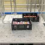 An electrodynamic shaker at the Michigan State University School of Packaging simulates transportation vibrations and their effects on different types of apple packaging.
