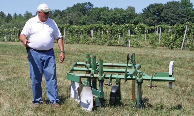 David Francis works at the research station and has developed this disk plow for hilling vines and covering an “insurance” cane.<b>(Richard Lehnert/Good Fruit Grower)</b>