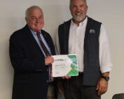 Derek Sandison, director of the Washington State Department of Agriculture, thanks Washington Apple Commission president Todd Fryhover for his service to the industry at the commission’s meeting on Oct. 15 in Ellensburg. Fryhover retires at the end of this month. (Kate Prengaman/Good Fruit Grower)