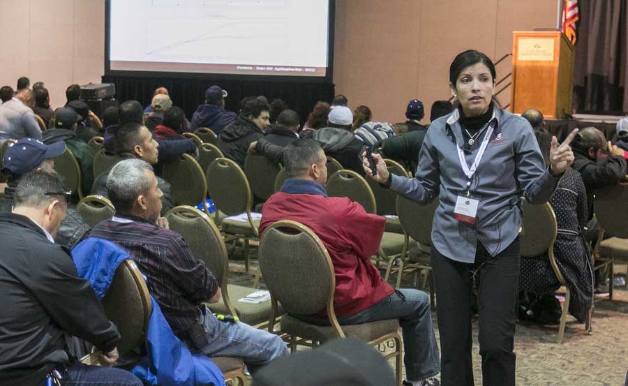 Melba Salazar-Gutierrez of Washington State University speaks about practical use of AgWeatherNet in orchards during one of the Spanish speaking sessions at the annual meeting of the Washington State Tree Fruit Association. <b>(TJ Mullinax/Good Fruit Grower)</b>