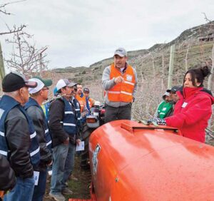 Ofelio Borges, Washington State Department of Agriculture, talks during a spray application training in Naches, Washington, held in March 2016 to help orchard workers improve results. (TJ Mullinax/Good Fruit Grower)