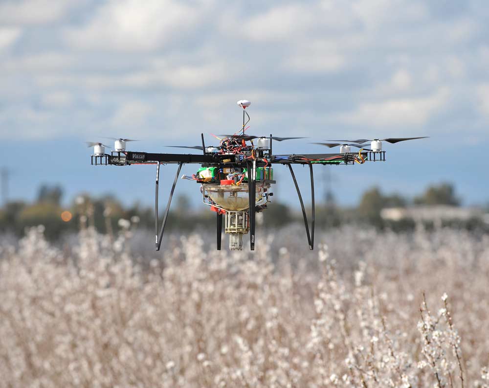 A first-generation prototype pollinator unit attached to the bottom of an industrial drone. <b>(Courtesy Dropcopter)</b>