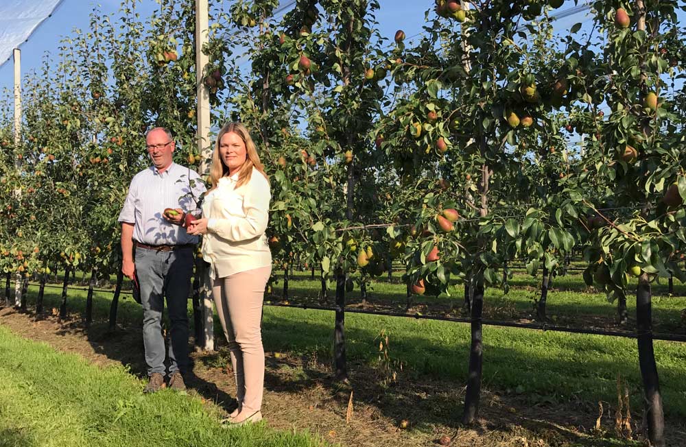 Grower Kris Wouters poses with his daughter Silke in one of the family orchards in Rummen, Belgium in August. <b>(Courtesy Kris Wouters)</b>
