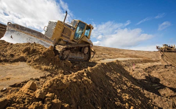 Stan Klabenes operates a large bulldozer on March 3, 2016, across the slope of a new cooling and frost control pond at a future orchard owned by Washington Fruit and Produce Co. near Kittitas, Washington. Klabenes works for Selland Construction, Inc., based in Wenatchee.<b>(TJ Mullinax/Good Fruit Grower)</b>