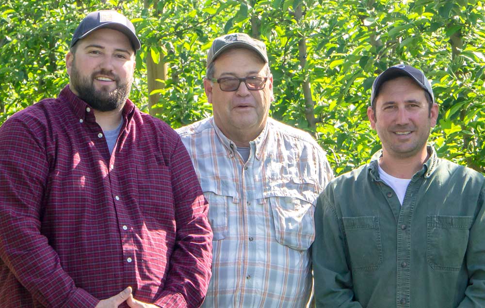 Dan Boyer, center, owns Ridgetop Orchards, and runs it with his sons, Mark, at left, and Seth, at right. Fishertown, PA on May 21, 2018 (Kate Prengaman/Good Fruit Grower)