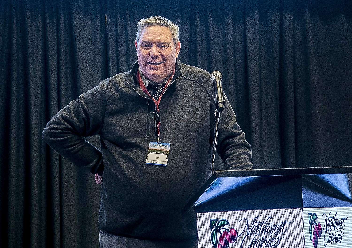 B.J. Thurlby speaks at the 81st Annual Cherry Institute in Yakima, Washington, in January 2024. Thurlby, who died Jan. 10 following surgery for cancer, hosted the meeting for 25 years as president of the Washington State Fruit Commission, a role he retired from in December. (TJ Mullinax/Good Fruit Grower)