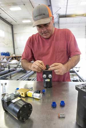 JJ Dagorett works on the Apple Vacuum System prototype picker