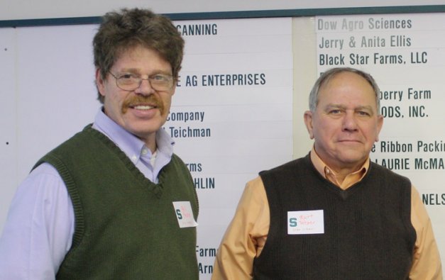 Peach breeder Bill Shane (left) and Michigan Peach Sponsors President Kurt Weber enjoyed the annual educational meeting they jointly prepared.