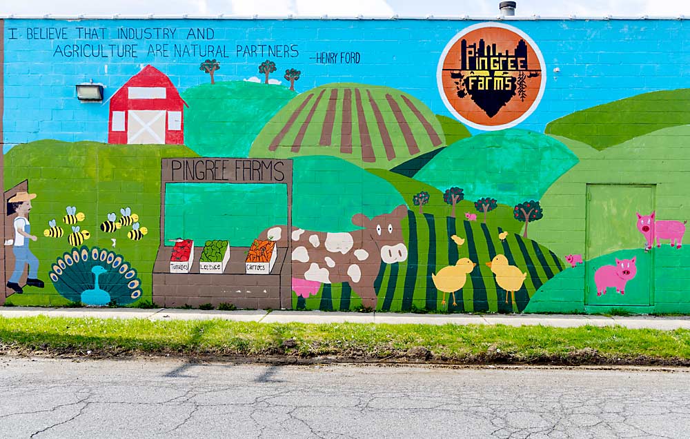 Agricultural art adorns the outer wall of a Pingree Farms warehouse. The nonprofit urban farm, owned by Milton Manufacturing, provided Drew Ryan Wines with land and a warehouse to aid their grape-growing and winemaking endeavors. (Matt Milkovich/Good Fruit Grower)