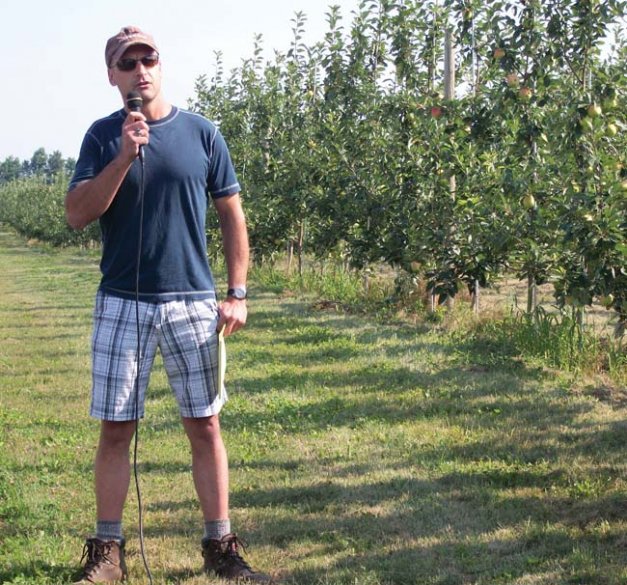 Michael Zingler stands next to a planting of SweeTango in its third leaf and describes the reasoning behind the design of the orchard: Efficient use of harvest labor.