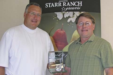 Scott Marboe (left) and Steve Reinholt with the World Trade Club’s 2006 Trader of the Year Award that Oneonta received.