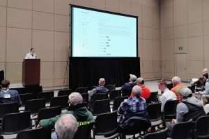 Michigan State University tree fruit integrator Jackie Perkins discusses the shifting climate and its implications for pest control during Day 1 of the 2025 Great Lakes EXPO, Dec. 9–11 in Grand Rapids. She spoke during the Apple 1 educational session. (Matt Milkovich/Good Fruit Grower)