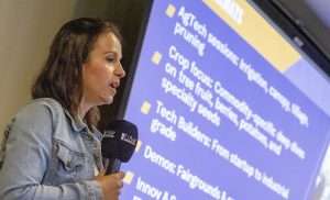 Maialen Cazenave, co-director of GOFAR, the Global Organization for Agricultural Robotics, speaks at a press conference on May 12, 2026, about bringing the FIRA USA conference to the Pacific Northwest in October at State Fair Park in Yakima, Washington. (TJ Mullinax/Good Fruit Grower)