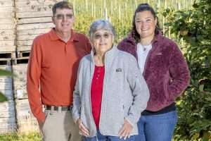 From left: Tom, Alison and Kristen DeMarree, the magazine’s 2025 Good Fruit Growers of the Year, at DeMaree Fruit Farm during harvest in Williamson, New York, in September.
